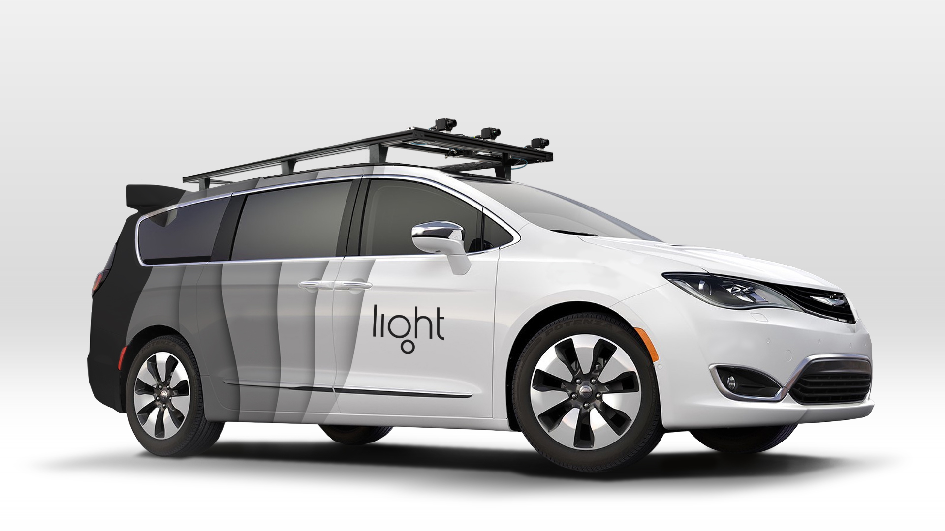 autonomous mini van with light logo on the side